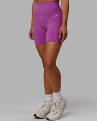 Woman wearing Base 2.0 Ultra High-Rise 6" Short - Hyper Violet