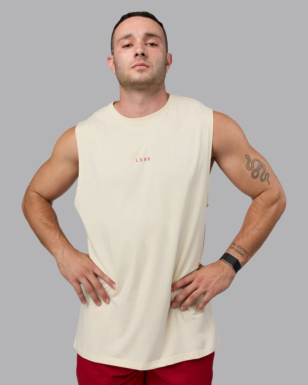 Man wearing Base FLXCotton Tank - Ivory-Cherry Red