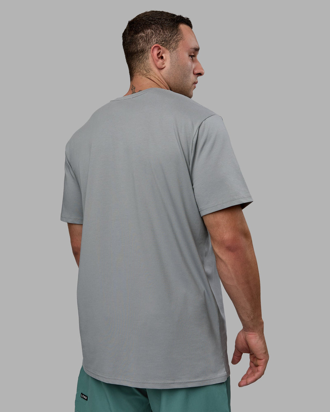 Man wearing Base FLXCotton Tee - Circular Grey