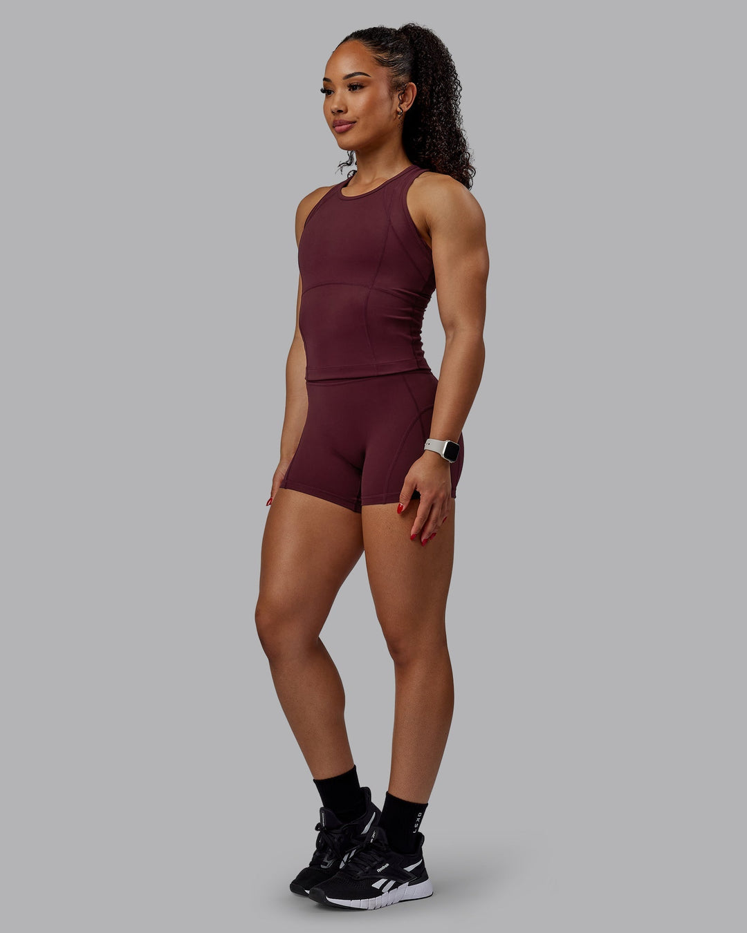 Woman wearing Bend Performance Tank - Dark Cherry