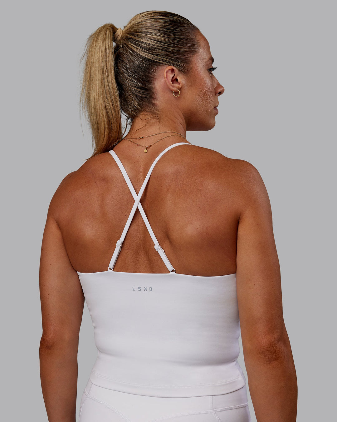 Woman wearing Bree Masters Form Shelf Bra Tank - White