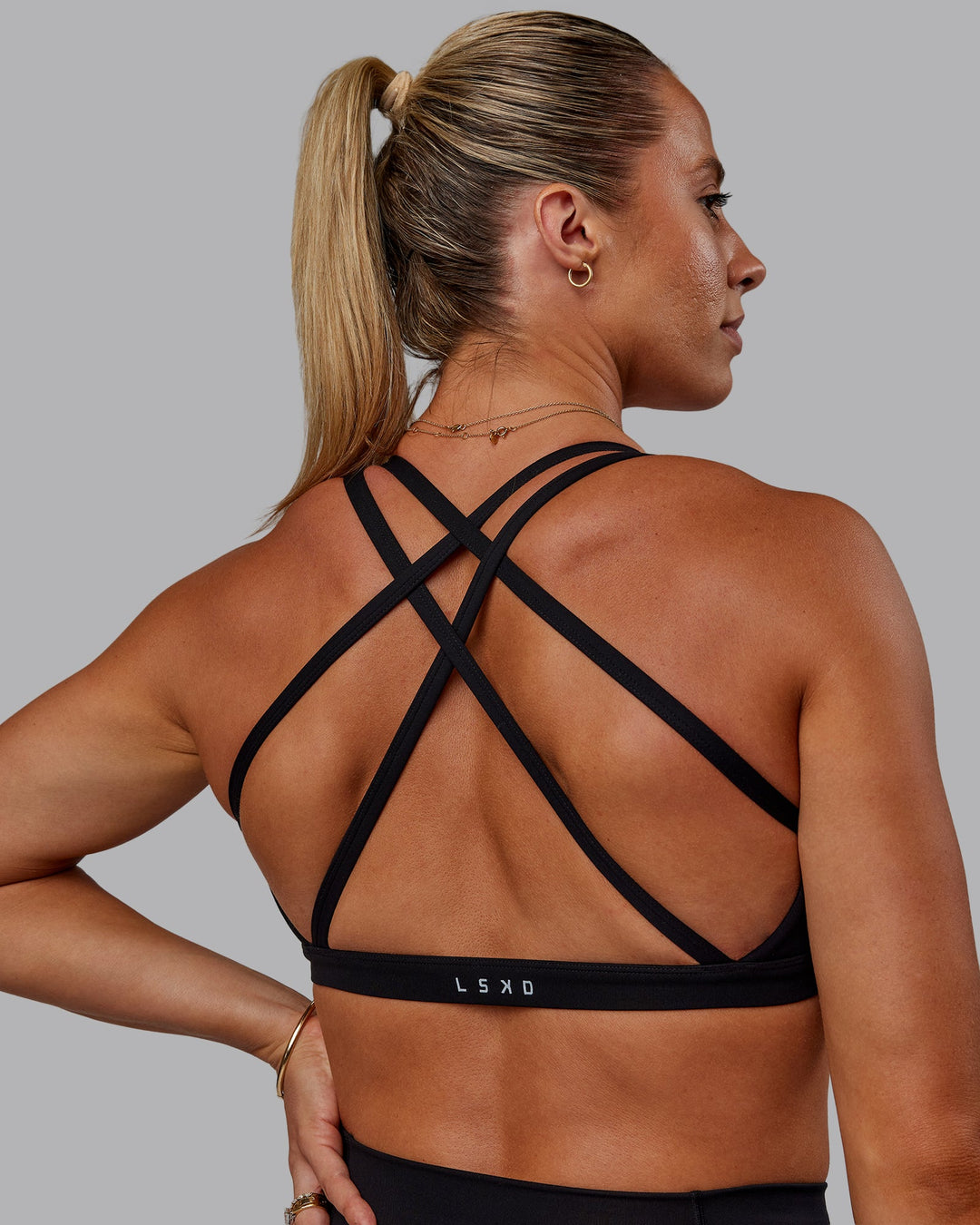 Woman wearing Bree Masters Velocity Sports Bra - Black