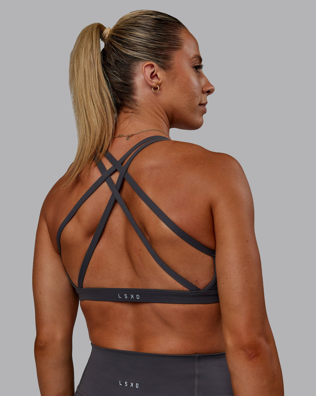 Woman wearing Bree Masters Velocity Sports Bra - Stormy