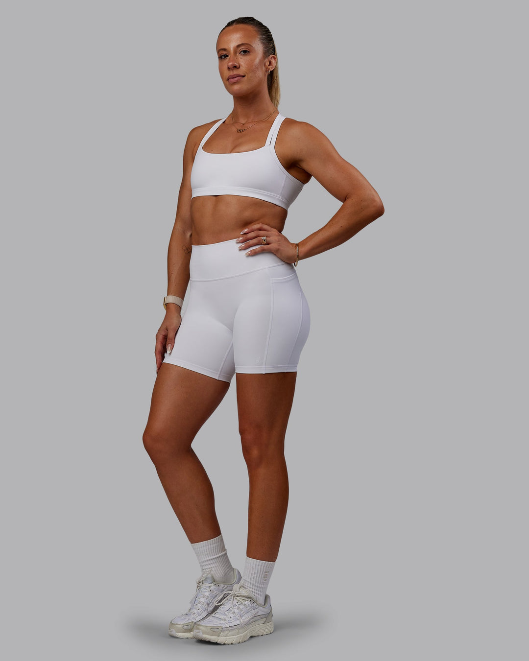 Woman wearing Bree Masters Velocity Sports Bra - White