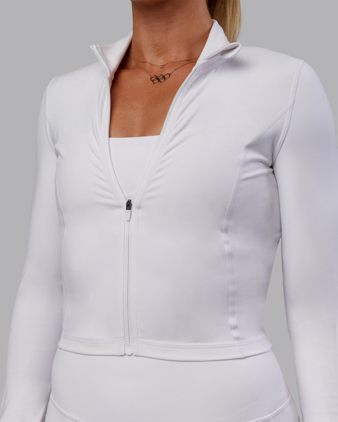 Woman wearing Bree Masters Stride Zip Through Cropped Jacket - White