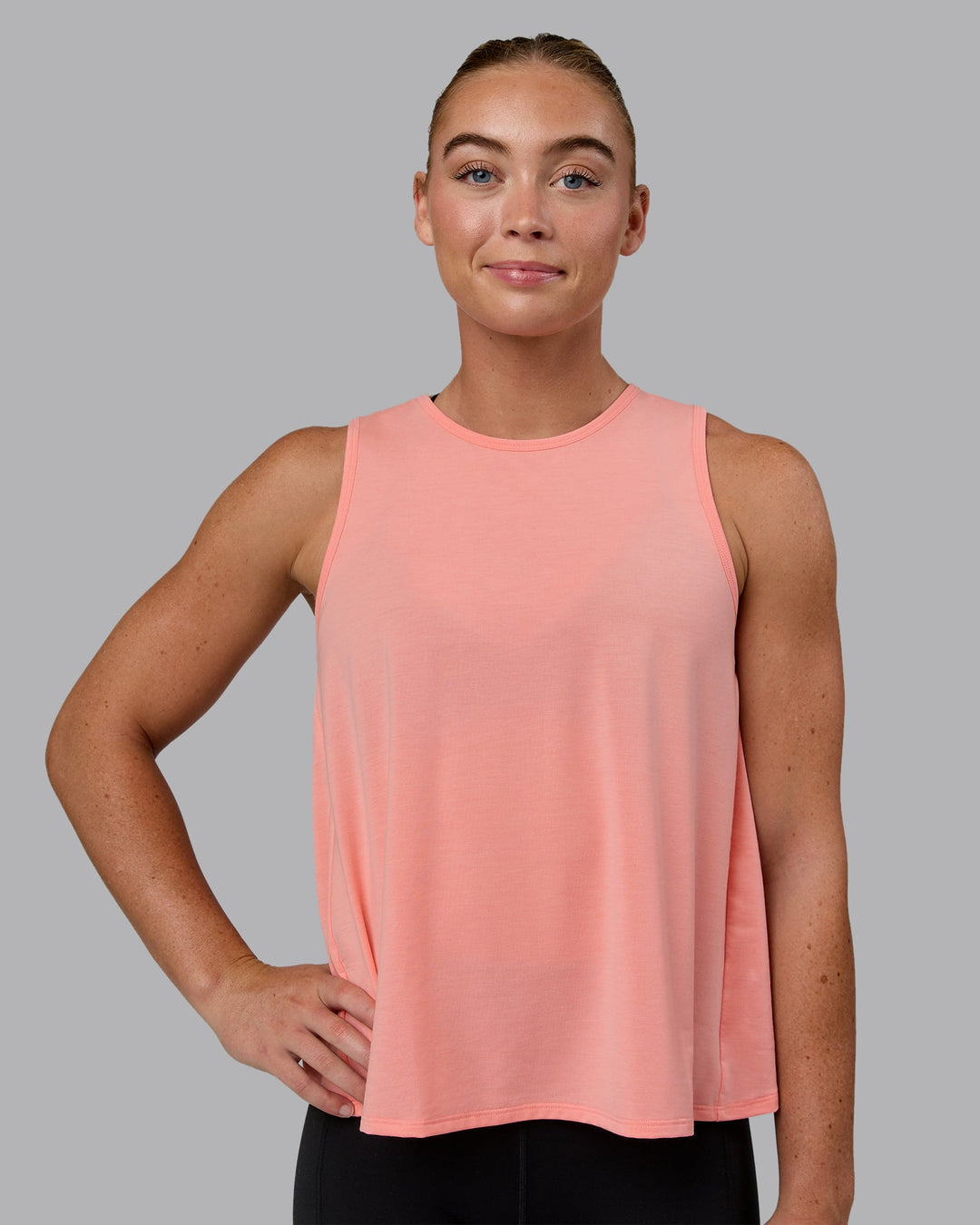 Woman wearing Breeze Training Tank - Murex Shell