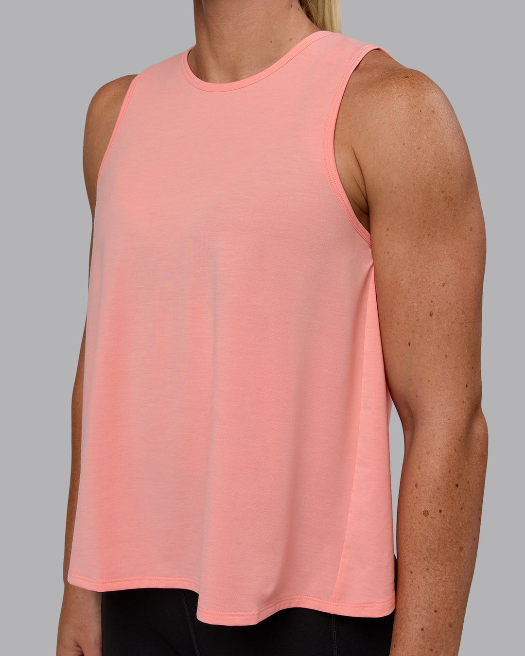 Woman wearing Breeze Training Tank - Murex Shell