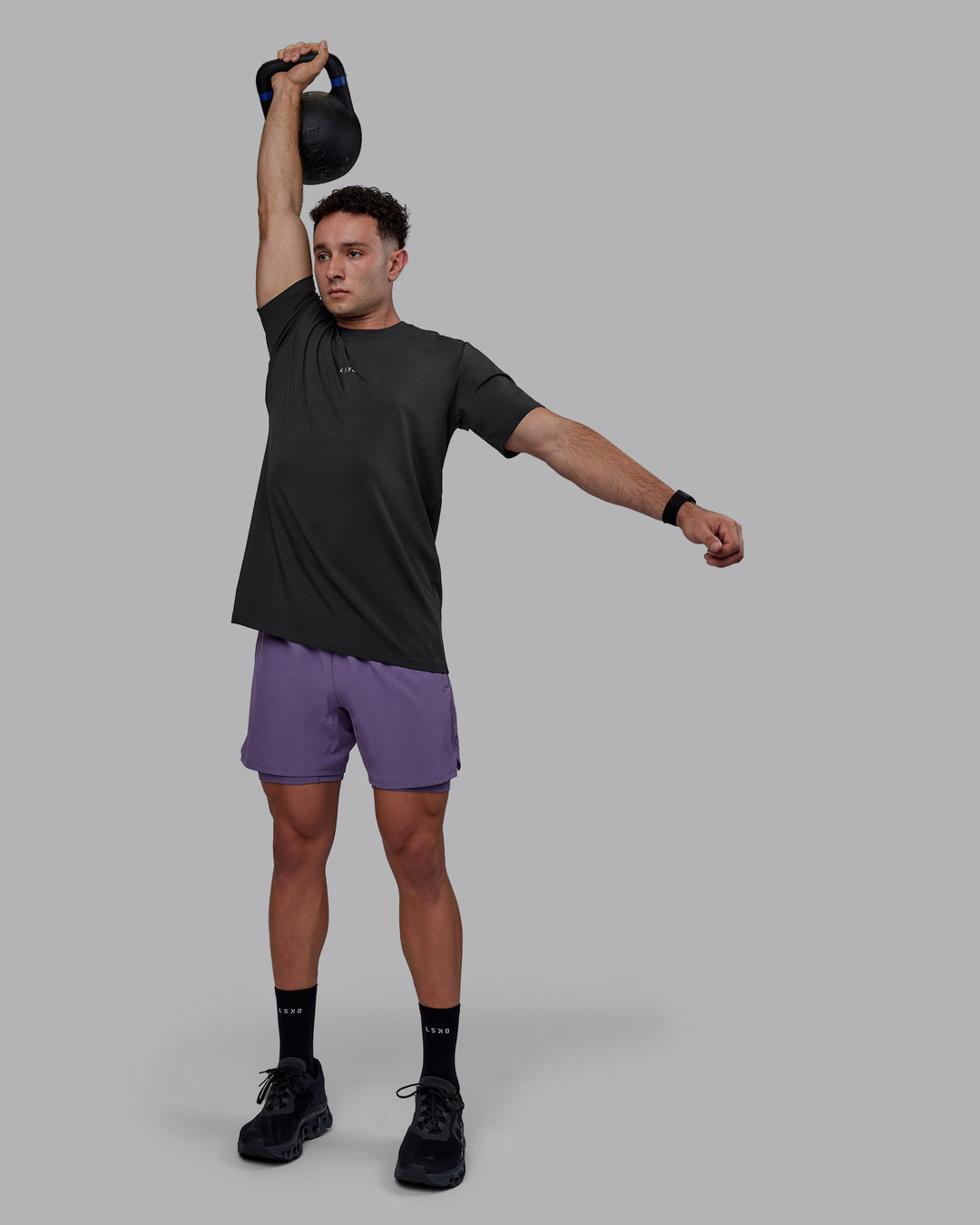 Man wearing Challenger 6&quot; Lined Performance Shorts - Purple Sage