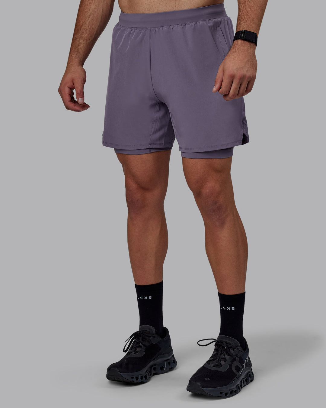 Man wearing Challenger 6&quot; Lined Performance Shorts - Purple Sage