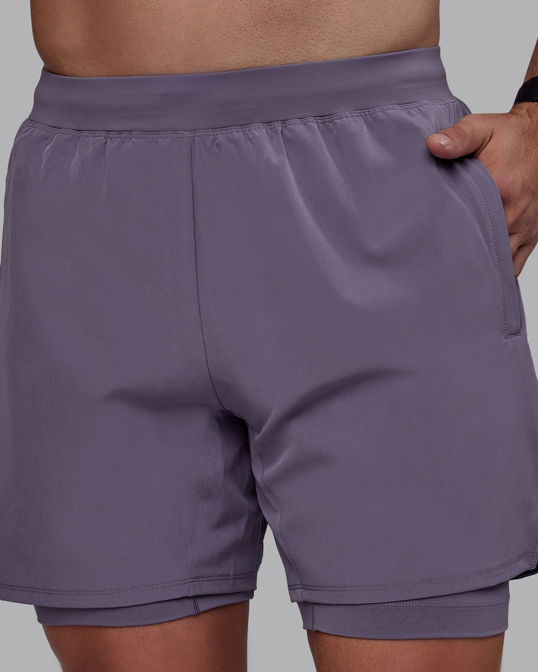 Man wearing Challenger 6&quot; Lined Performance Shorts - Purple Sage