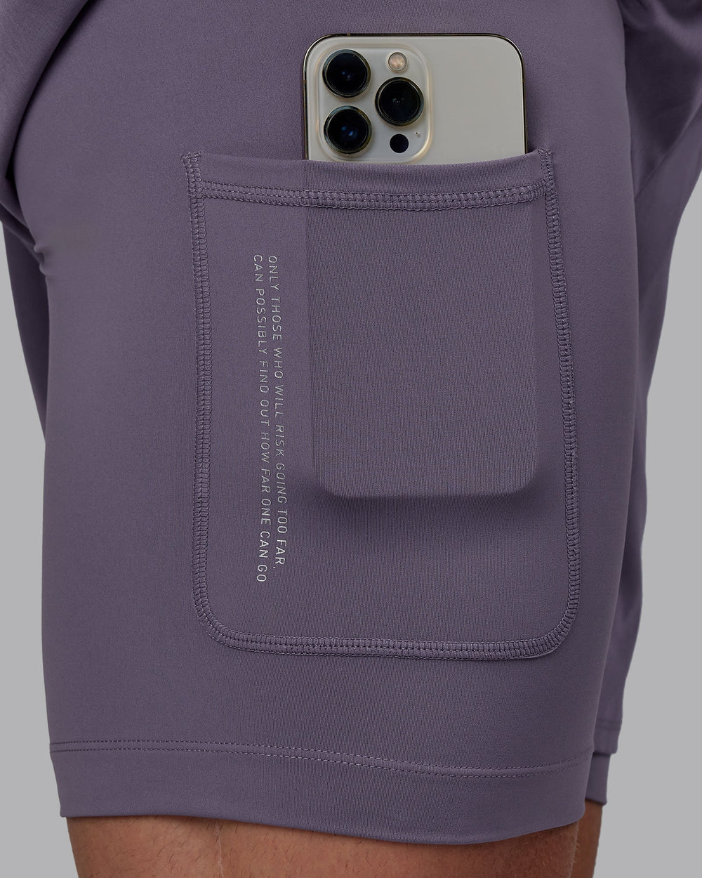 Man wearing Challenger 6" Lined Performance Shorts - Purple Sage