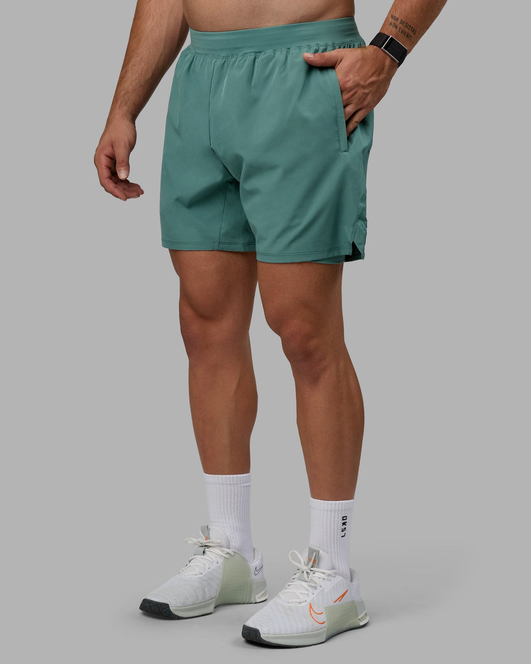 Man wearing Challenger 6&quot; Lined Performance Shorts - Sagebrush