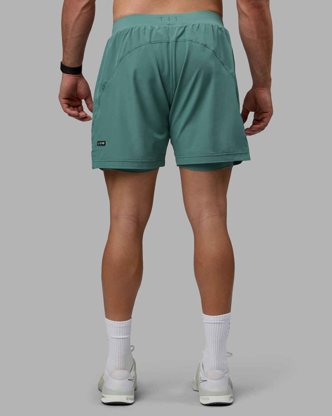 Man wearing Challenger 6&quot; Lined Performance Shorts - Sagebrush