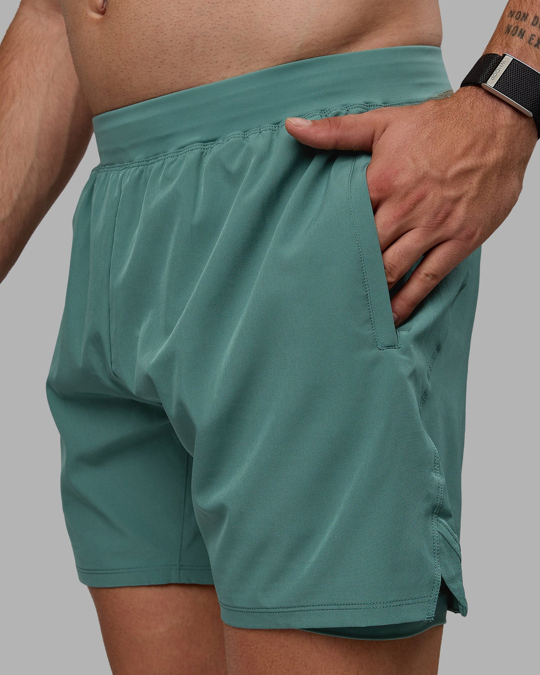 Man wearing Challenger 6&quot; Lined Performance Shorts - Sagebrush