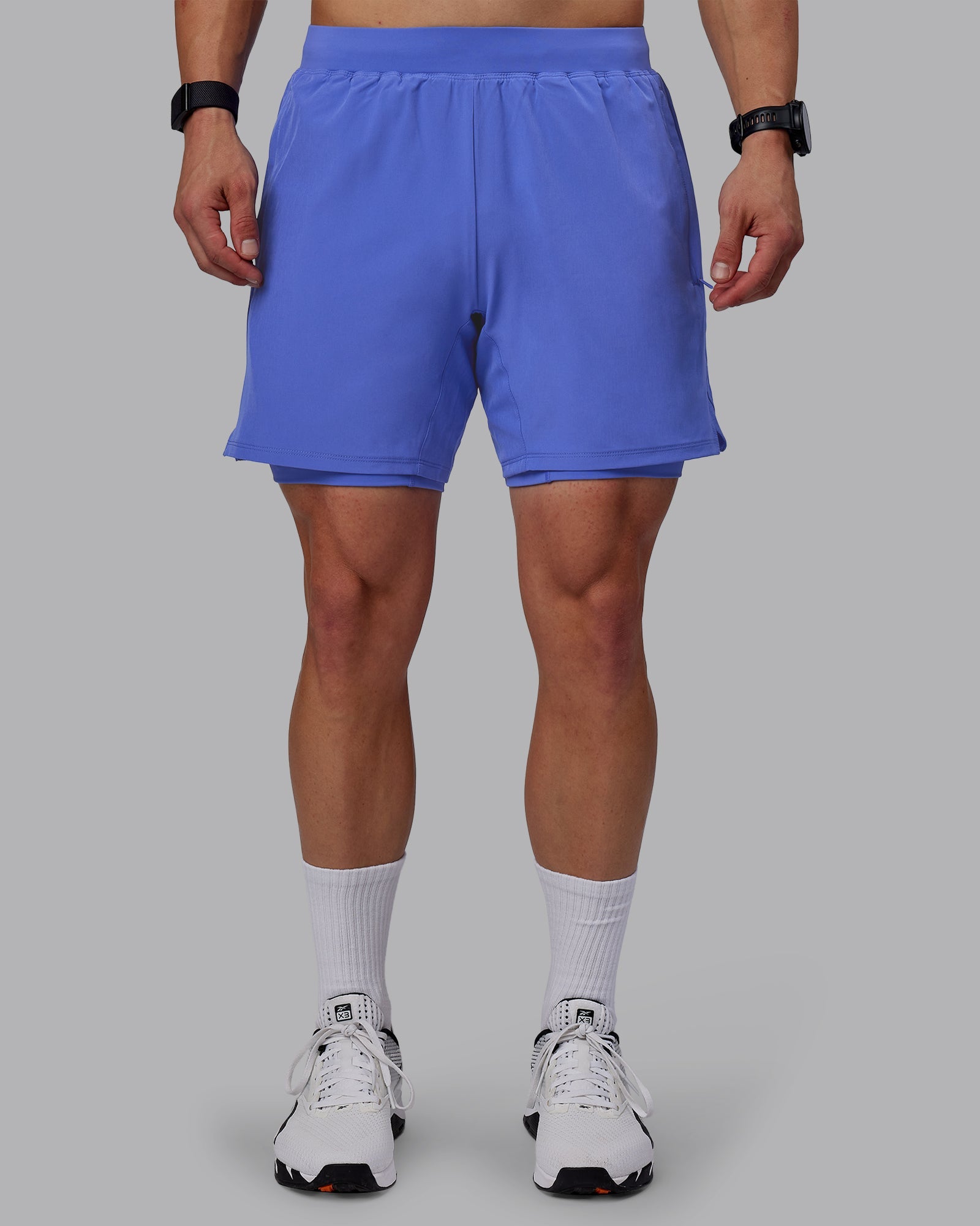 Man wearing Challenger 6" Lined Performance Shorts - Baja Blue