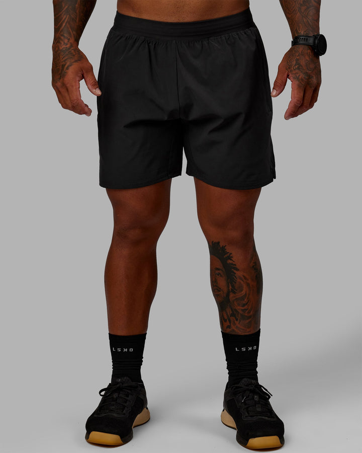 Man wearing Challenger 6&quot; Lined Performance Shorts - Pirate Black
