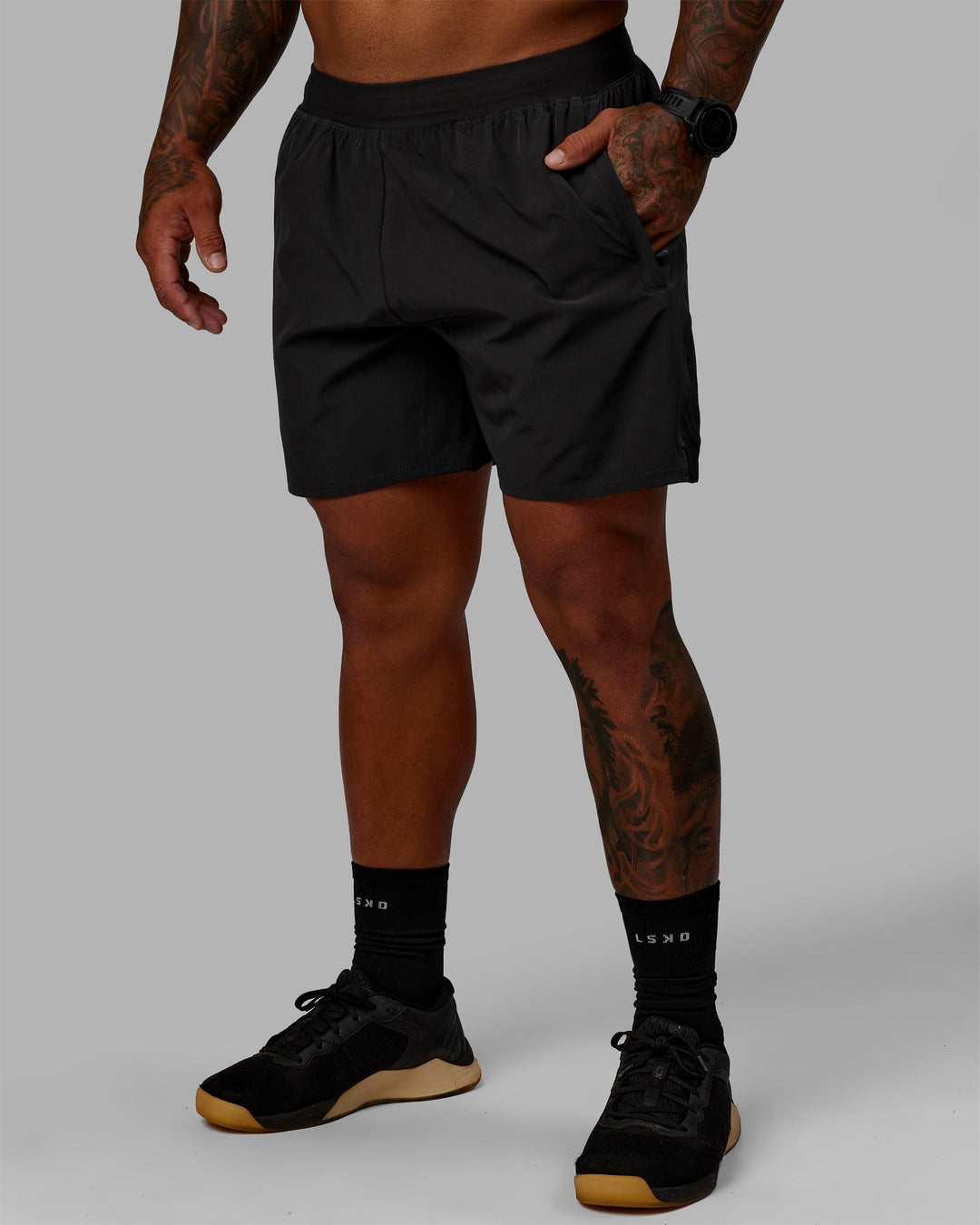 Man wearing Challenger 6&quot; Lined Performance Shorts - Pirate Black