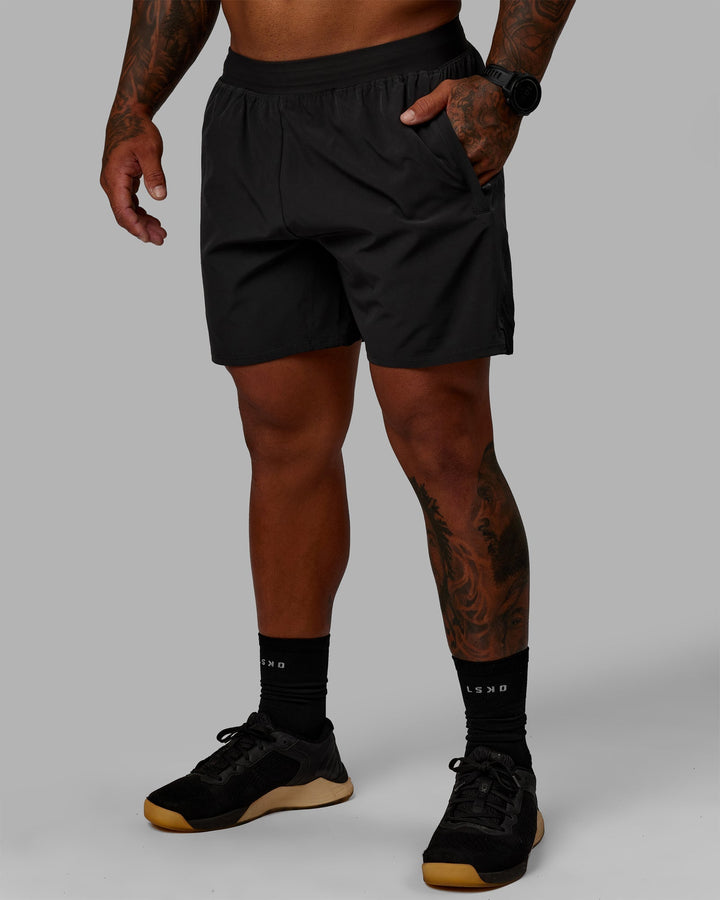 Man wearing Challenger 6&quot; Lined Performance Shorts - Pirate Black
