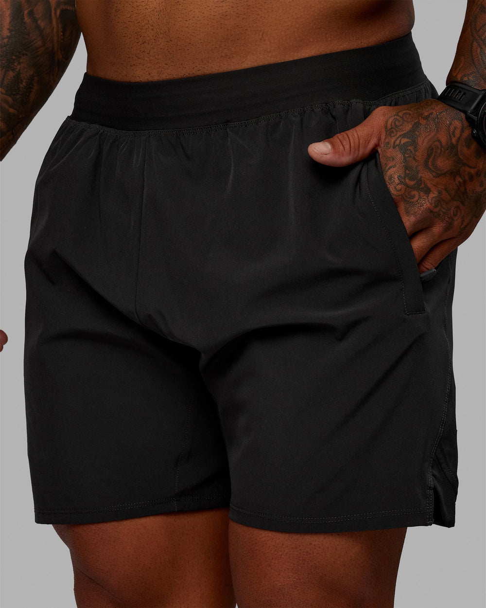 Man wearing Challenger 6" Lined Performance Shorts - Pirate Black