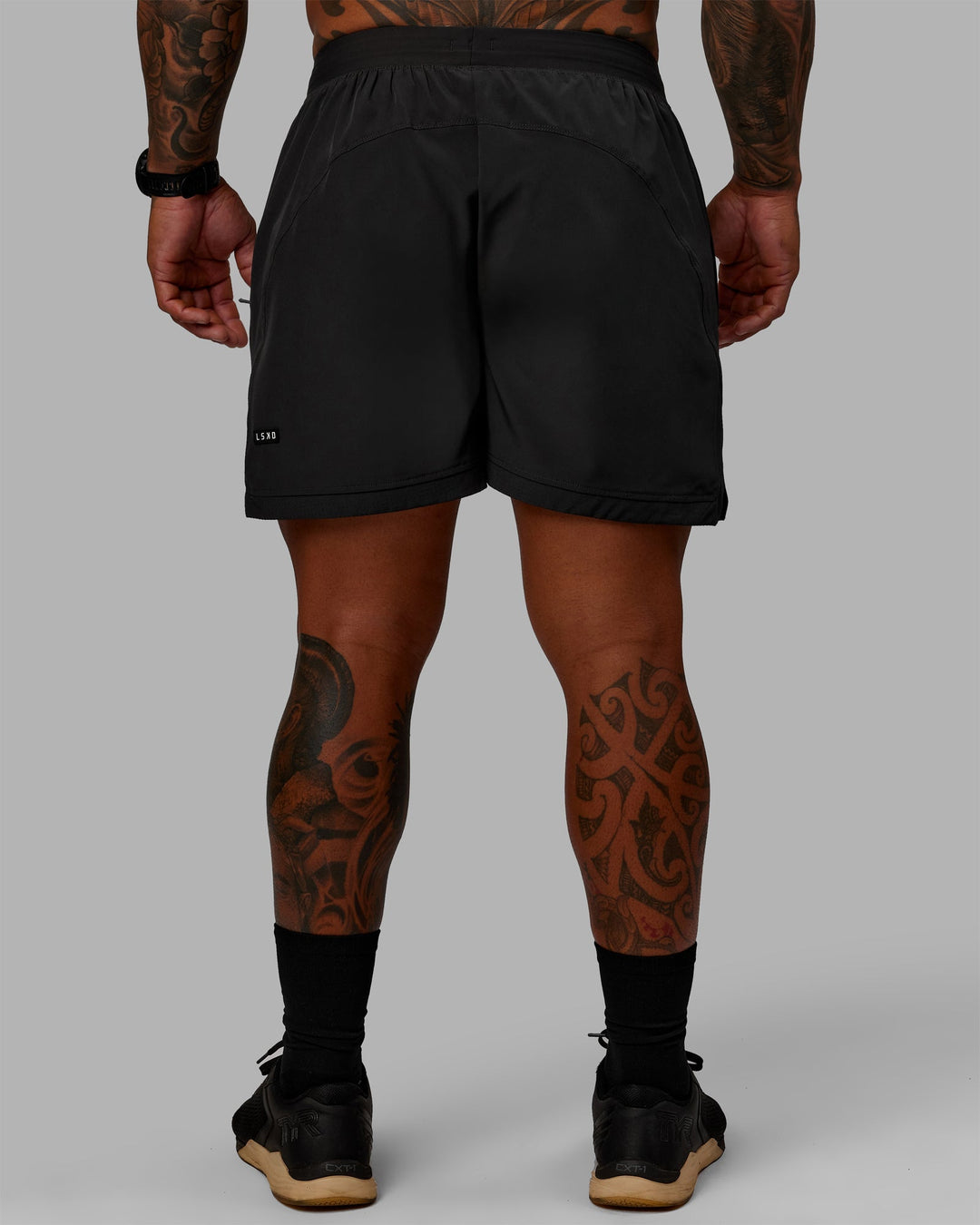 Man wearing Challenger 6&quot; Lined Performance Shorts - Pirate Black