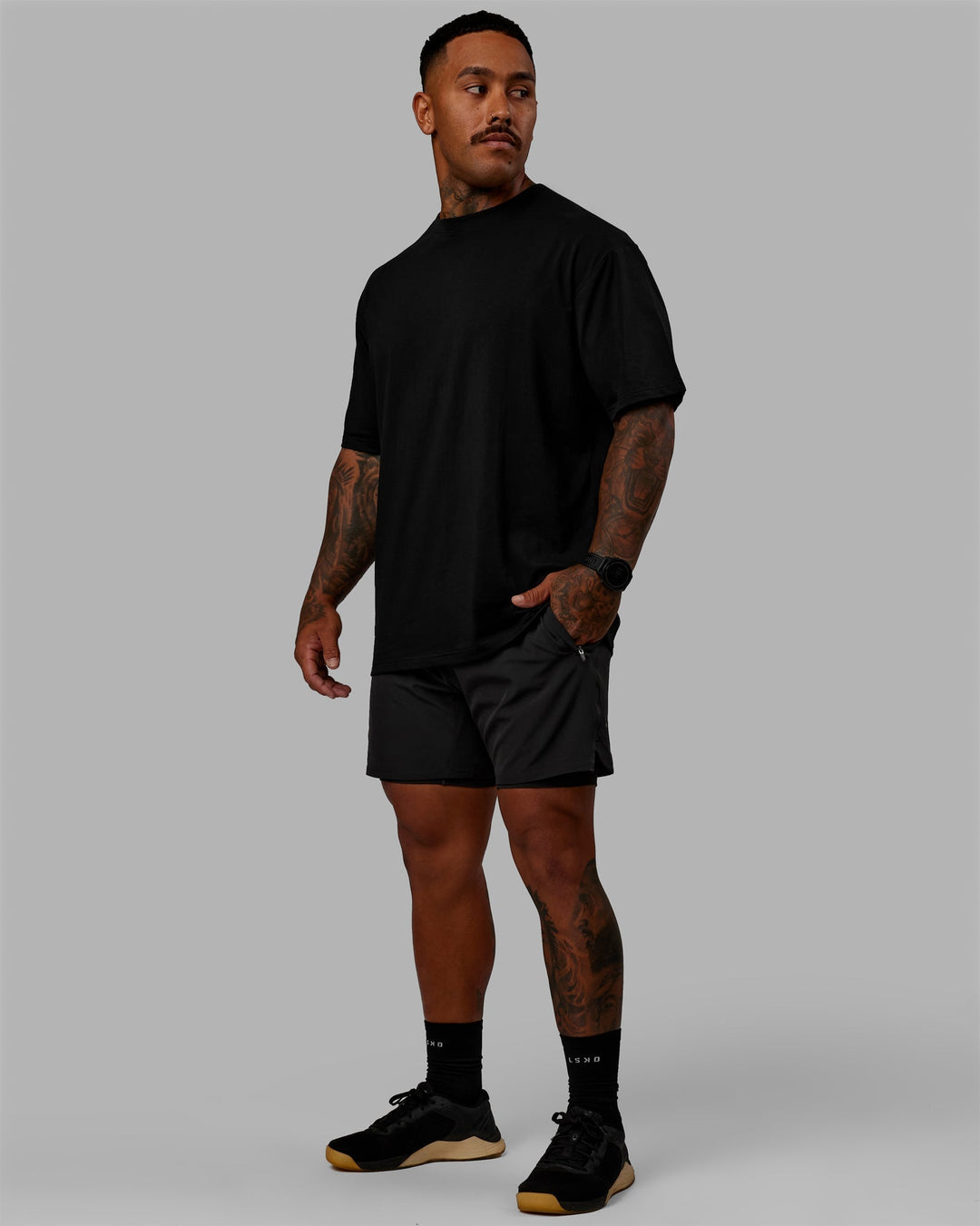 Man wearing Challenger 6&quot; Lined Performance Shorts - Pirate Black