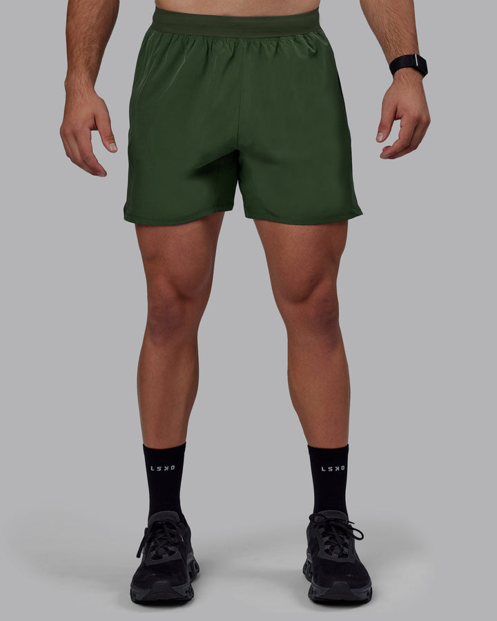 Man wearing Challenger 6&quot; Performance Shorts - Cilantro
