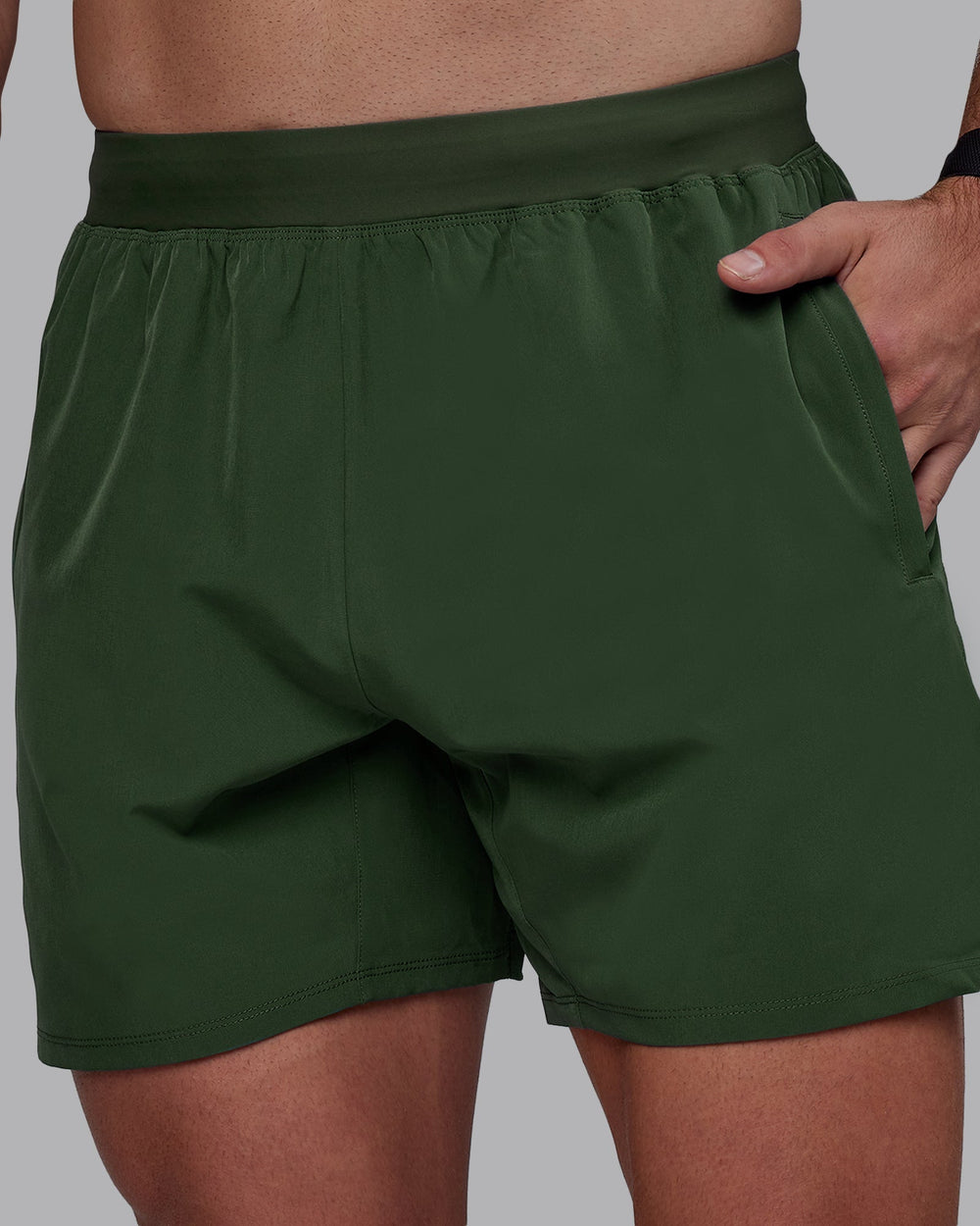 Man wearing Challenger 6" Performance Shorts - Cilantro