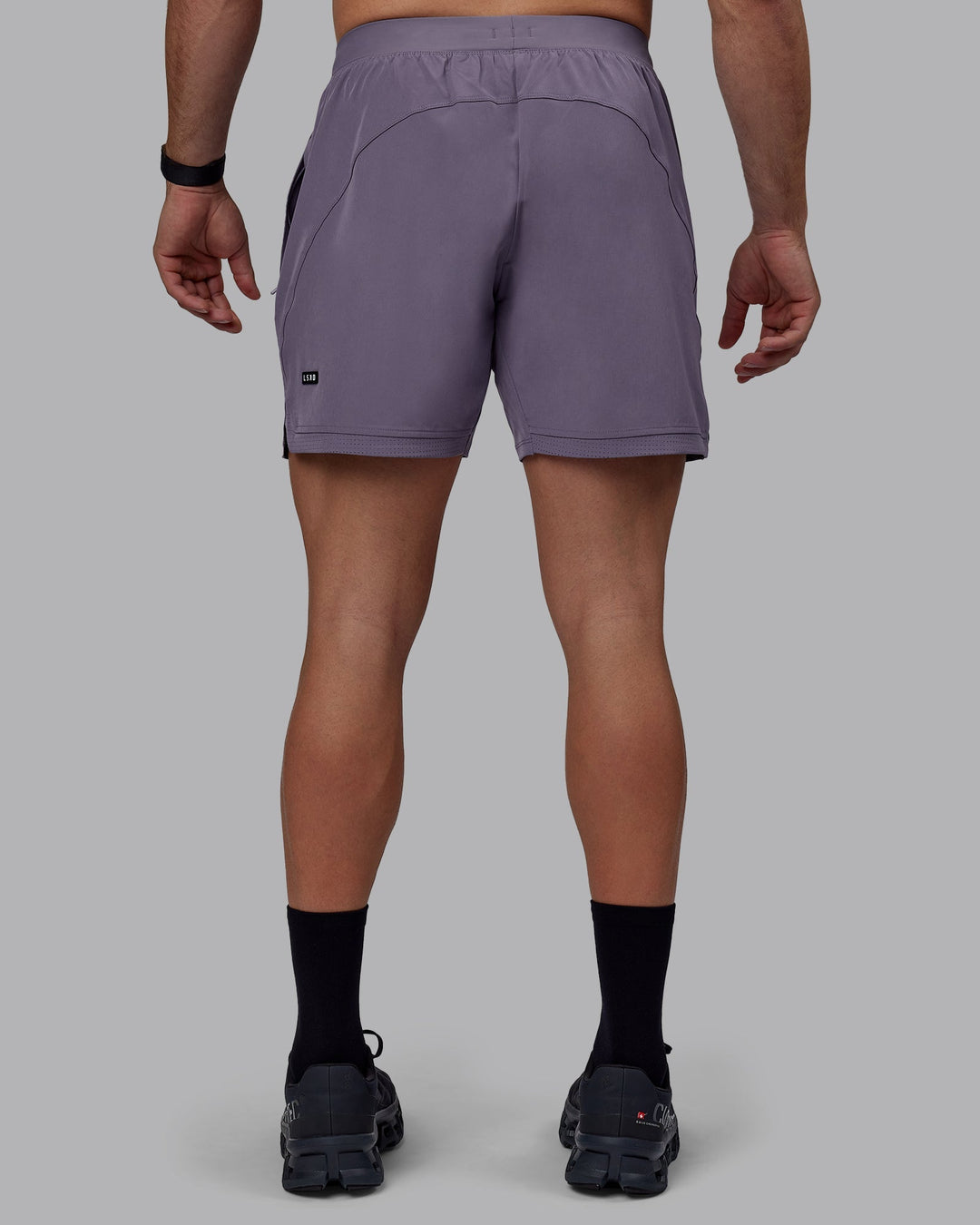 Man wearing Challenger 6&quot; Performance Shorts - Purple Sage