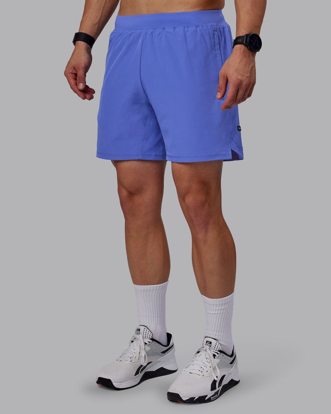 Man wearing Challenger 6&quot; Performance Shorts - Baja Blue