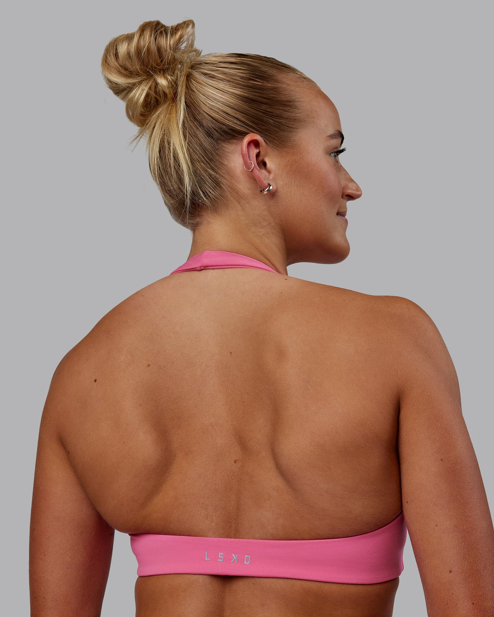 Woman wearing Challenger Sports Bra - Carmine Rose