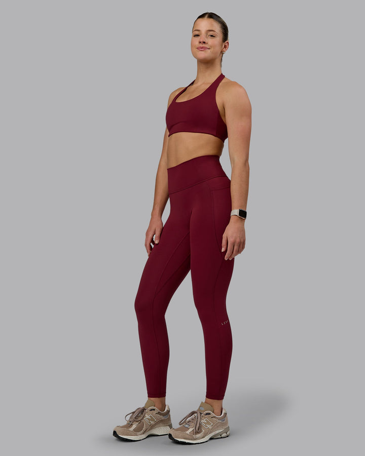 Woman wearing Challenger Sports Bra - Cordovan
