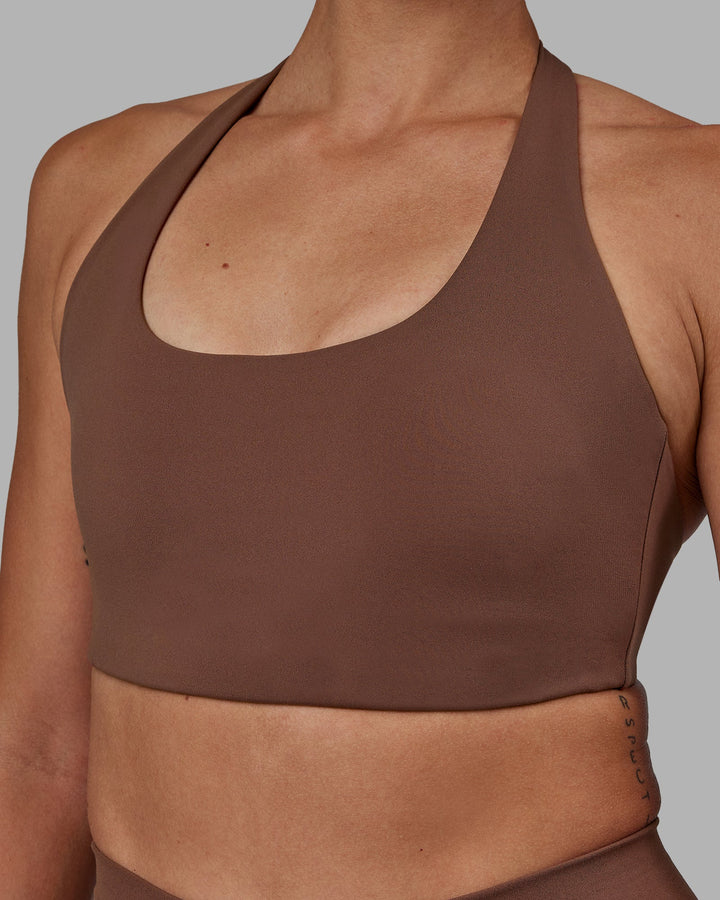 Woman wearing Challenger Sports Bra - Dull Rust
