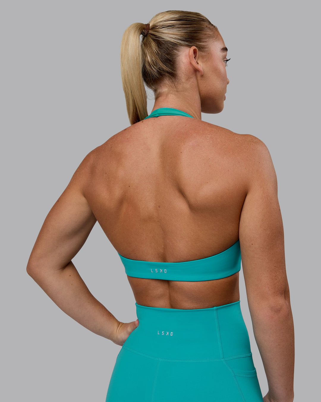 Woman wearing Challenger Sports Bra - Uplift Blue