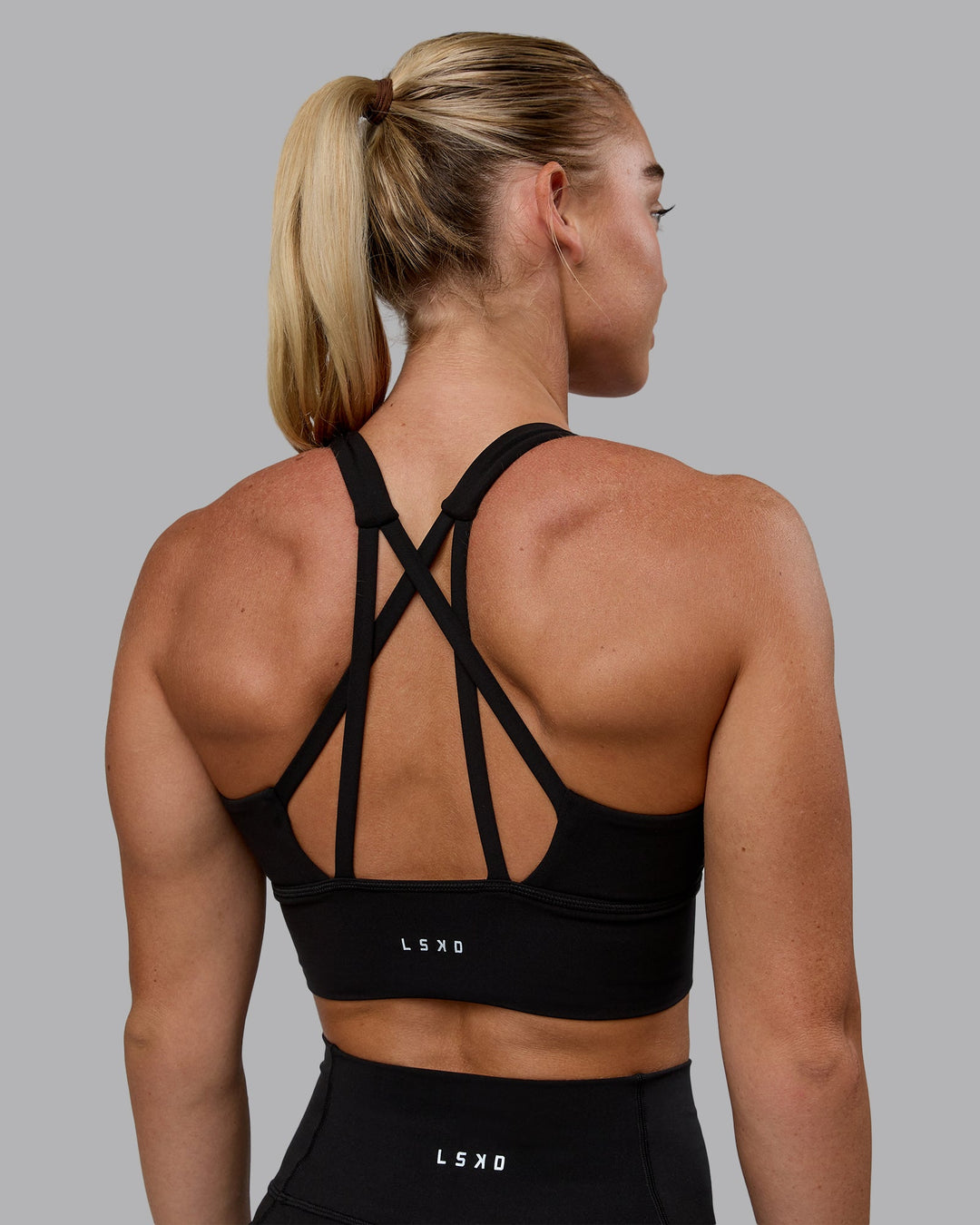 Woman wearing Circuit Sports Bra - Black