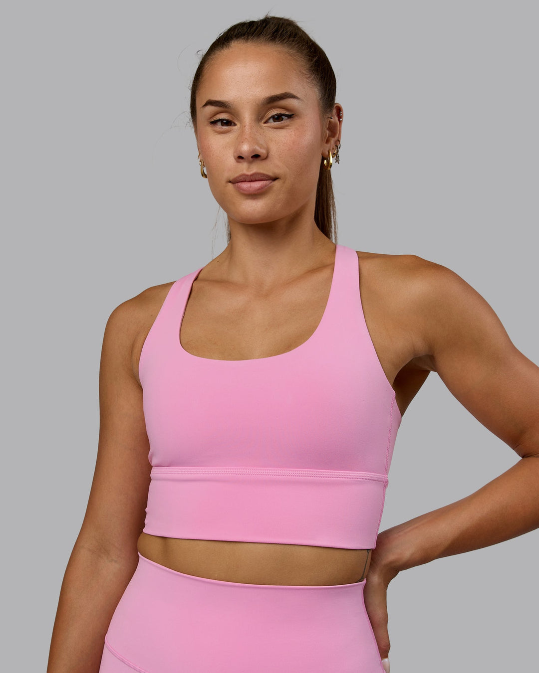 Woman wearing Circuit Sports Bra - Bubblegum