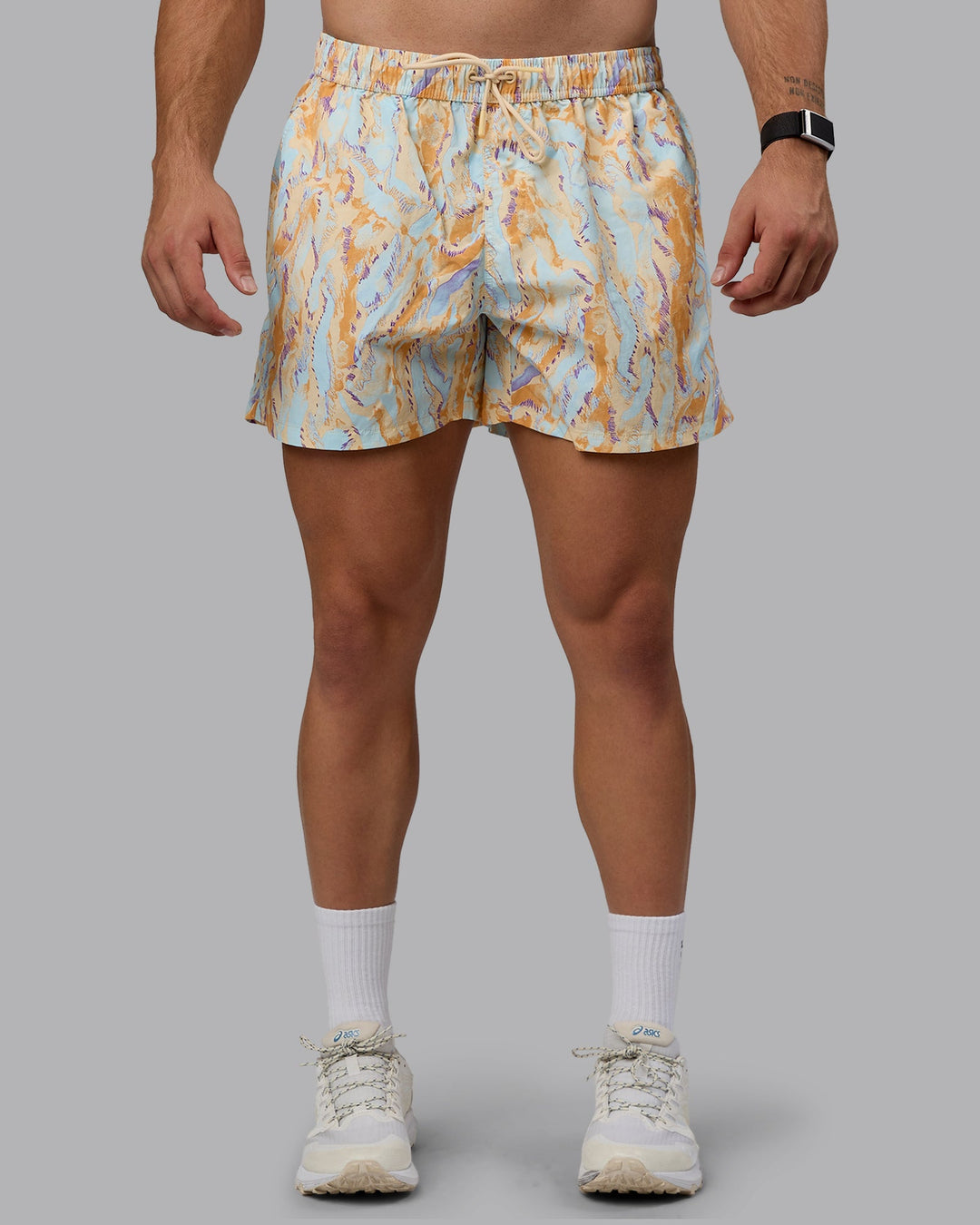 Man wearing Classic 5" Shorts - Brush Orange Cream