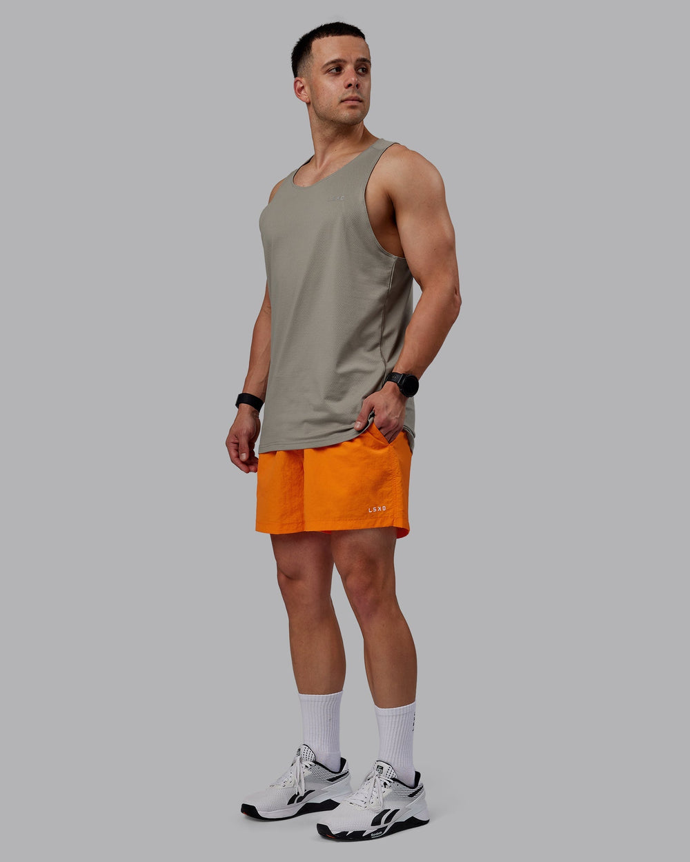 Man wearing Classic 5" Shorts - Vibrant Orange