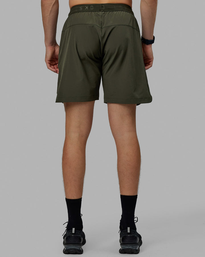 Man wearing Competition 8" Performance Short - Forest Night