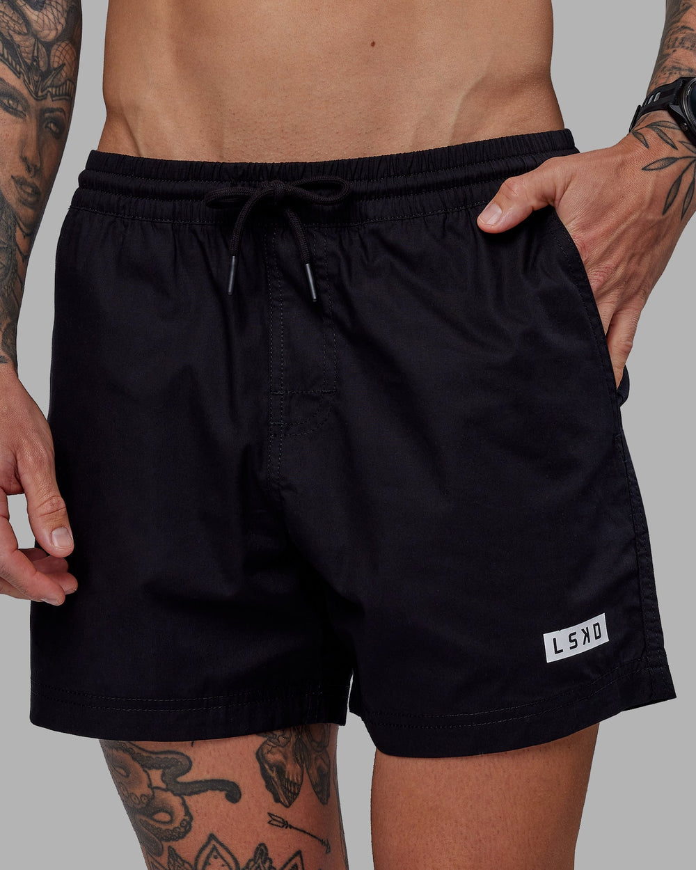 Man wearing Daily 5" Shorts - Black-White