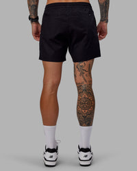 Man wearing Daily 5" Shorts - Black-White | Thumbnail Index: 3