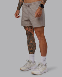 Man wearing Daily 5" Shorts - Shale Beige