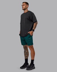 Man wearing Daily 7" Shorts - Dark Moss | Thumbnail Index: 4