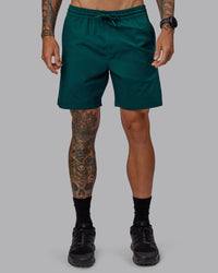 Man wearing Daily 7" Shorts - Dark Moss