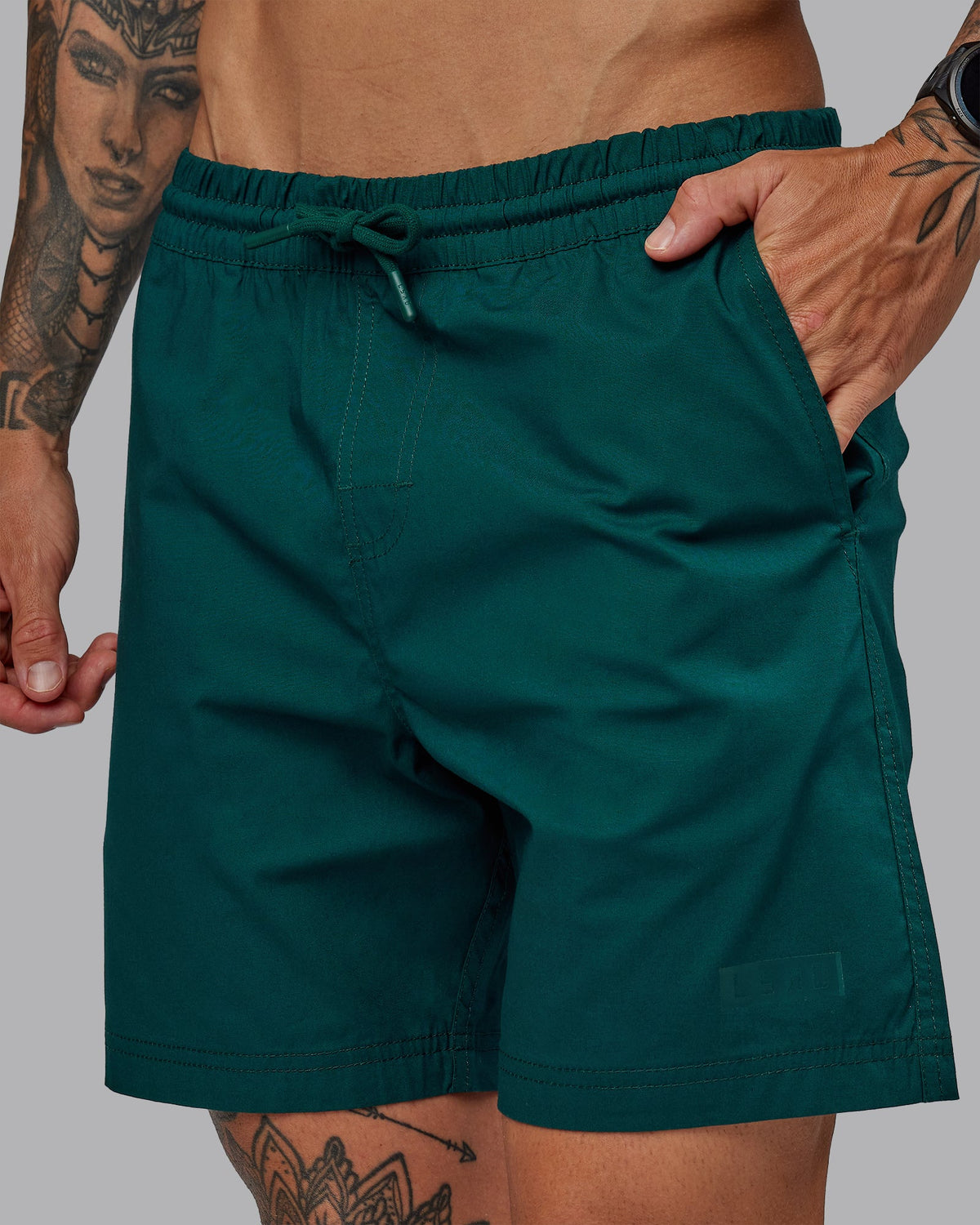 Man wearing Daily 7" Shorts - Dark Moss - view 1