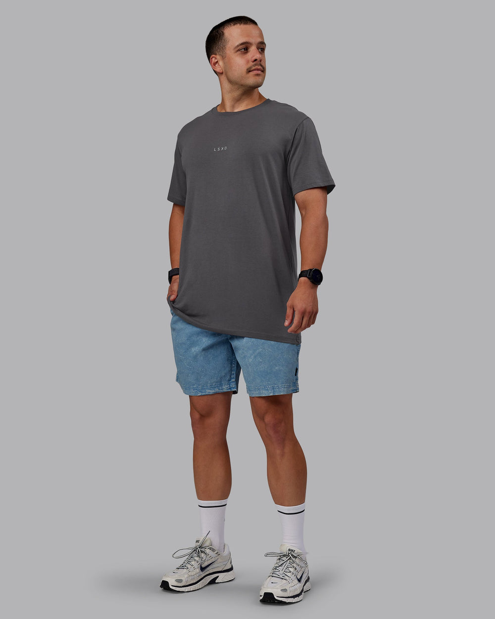 Man wearing Washed Daily 7" Shorts - Elemental Blue