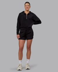 Woman wearing Elevate SoftTouch 4" Shorts - Black-Black