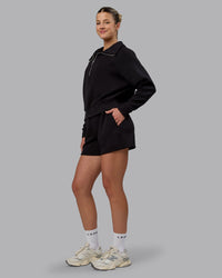 Woman wearing Elevate SoftTouch 4" Shorts - Black-Black
