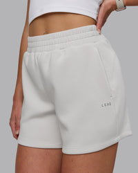 Woman wearing Elevate SoftTouch 4" Shorts - Clay-Clay