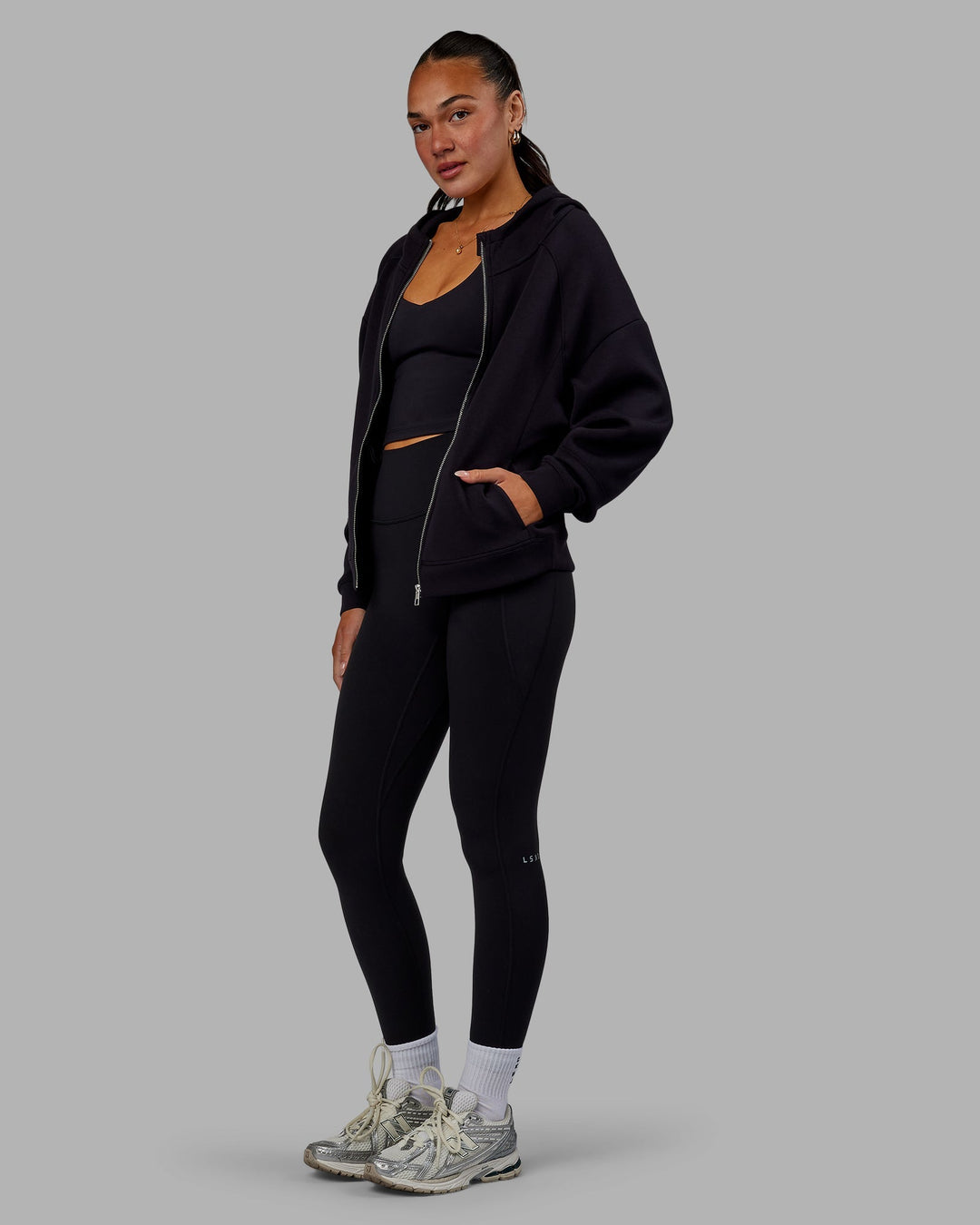 Woman wearing Elevate SoftTouch Zip Through Hoodie - Black-Black