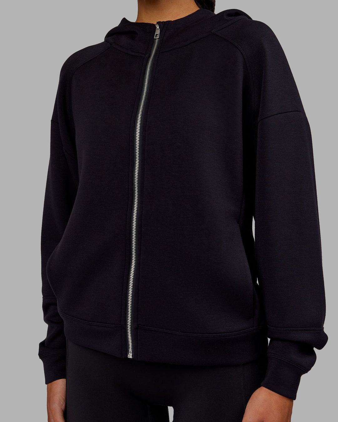 Woman wearing Elevate SoftTouch Zip Through Hoodie - Black-Black